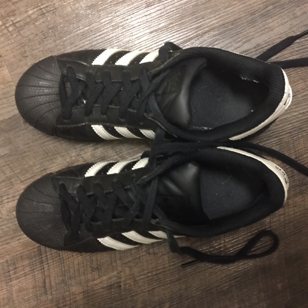 adidas Superstar shoes in black and white